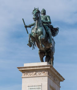 Low angle view of statue against sky