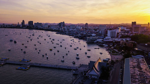 High angle view of city buildings during sunset