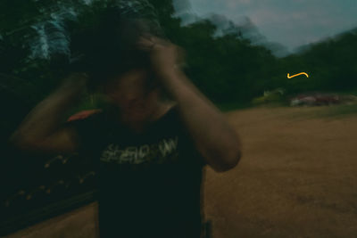 Man standing against blurred background