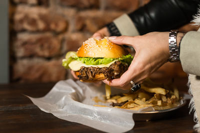 Midsection of woman holding food