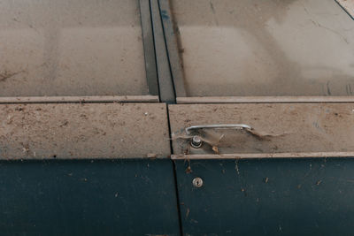 Close-up of old metal car door