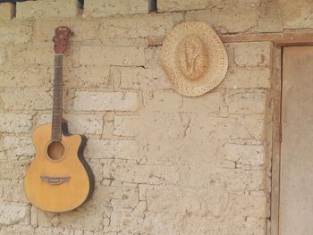 Close-up of guitar on wall