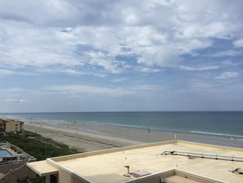 Scenic view of sea against cloudy sky