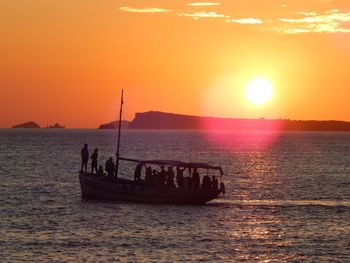 Scenic view of sea against orange sky