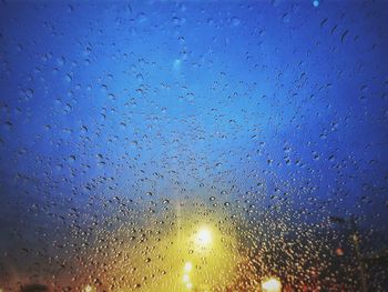 Full frame shot of raindrops on glass window