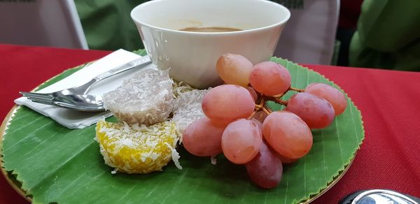 High angle view of fruits in plate on table