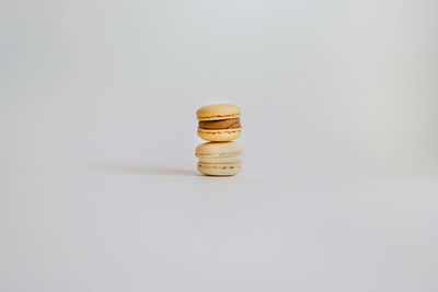 Beautiful tasty color macarons on background, in the shape of pyramid.