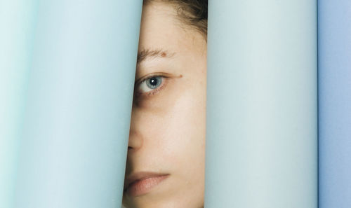 Close-up portrait of woman looking through papers