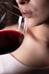 Close-up of woman drinking wine