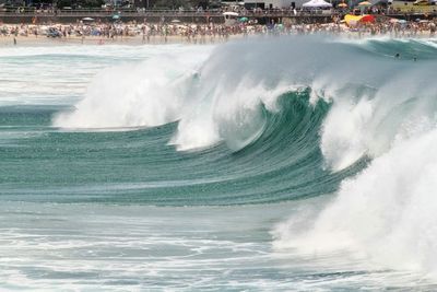 Waves breaking against sea