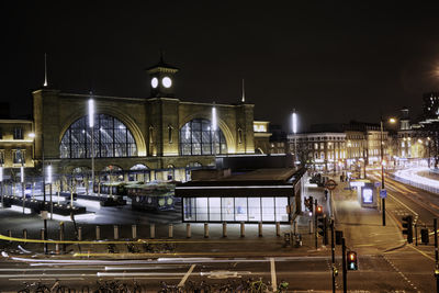 View of illuminated railroad station at night