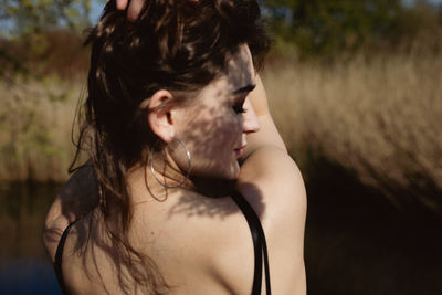 Rear view of woman against plants