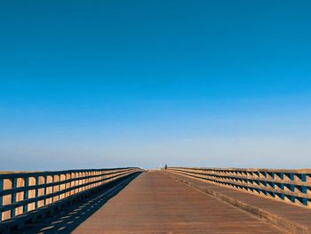 View of bridge against clear blue sky