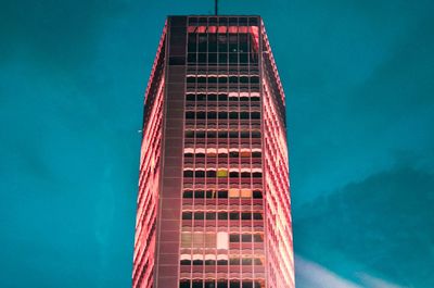 Low angle view of building against blue sky at dusk