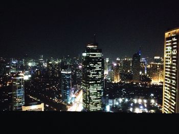 Illuminated cityscape at night