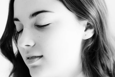 Close-up of teenage girl with eyes closed
