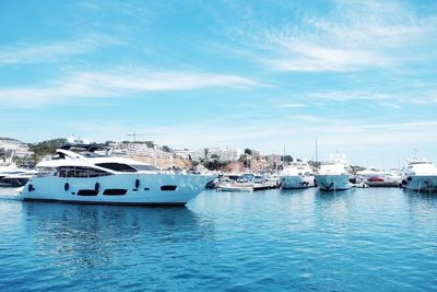 Boats moored at harbor