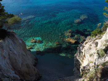 High angle view of rocks on sea