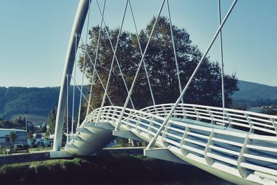 Tilt image of bridge against sky