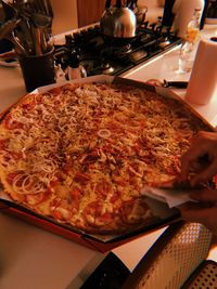 Close-up of pizza served on table