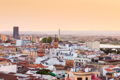 High angle view of town against sky during sunset