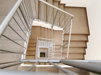 Directly below shot of spiral staircase of building