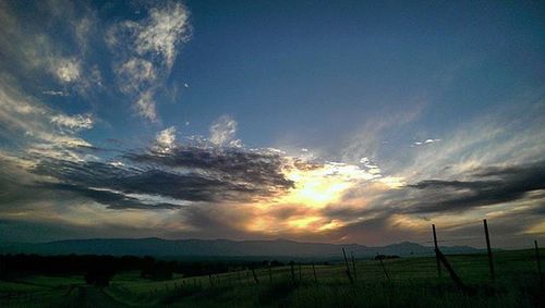 Scenic view of landscape at sunset