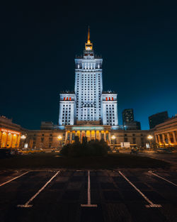 Illuminated buildings in city at night