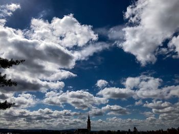 Low angle view of building against cloudy sky