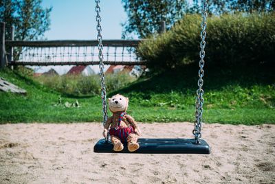 Toy on swing in park