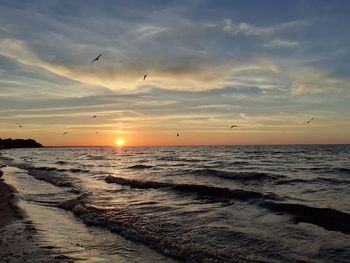 Scenic view of sea against sky during sunset