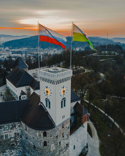 High angle view of buildings in city during sunset
