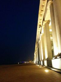 Low angle view of illuminated building against clear sky