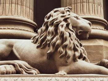 Close-up of statue against building