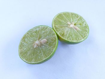 High angle view of lemon slice on white background