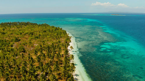 Sandy beach and tropical islands by atoll with coral reef, top view. patongong island 