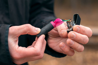 Close-up of man holding hands