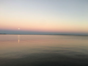 Scenic view of sea against clear sky during sunset