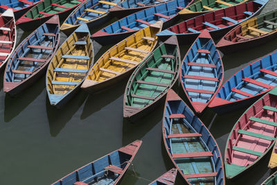 High angle view of boats moored at harbor