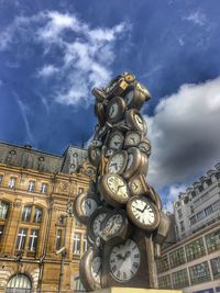 Low angle view of clock tower against building