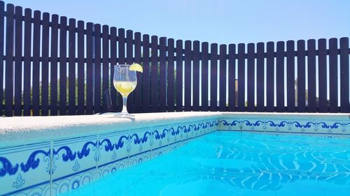 Full frame shot of water in swimming pool against clear blue sky