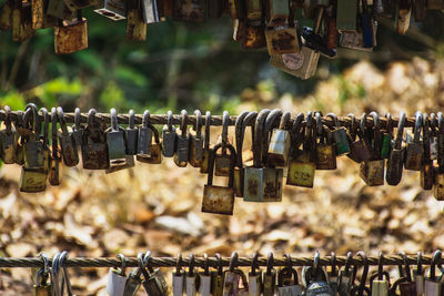 Padlocks hanging on railing