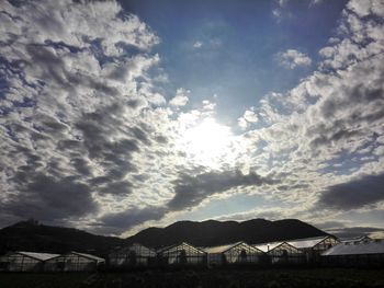 Scenic view of mountains against cloudy sky