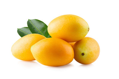 Close-up of oranges against white background