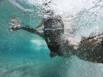 Man swimming in sea