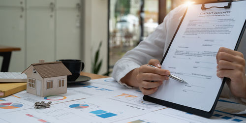 Midsection of business colleagues working in office