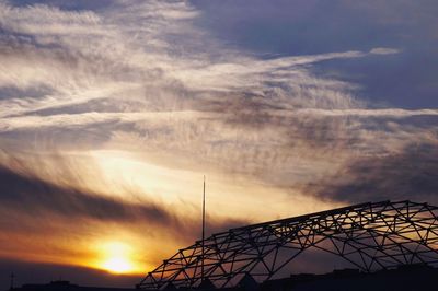 Low angle view of cloudy sky at sunset