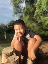 Portrait of boy against plants