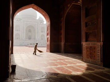 Full length of man walking in historic building