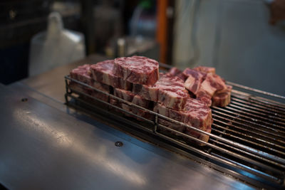 Close-up of meat on barbecue grill